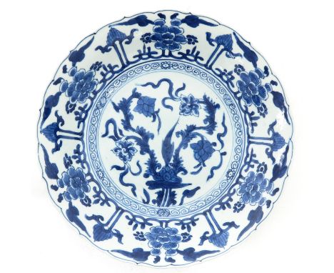 Floral decor, marked with double ring, 27 cm. in diameter, chip.
