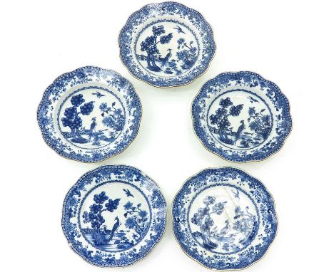 Decorated with garden scene, 23 cm. in diameter, chip and hairline.