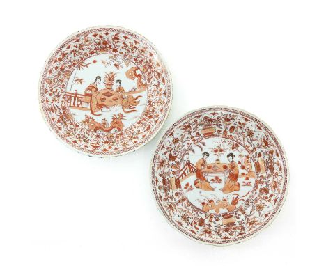 Depicting Chinese figures in garden, 23 cm. in diameter, one plate restored. 