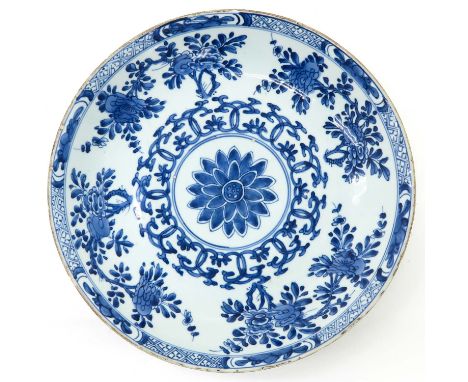 Floral decor, 18th Century, marked with double ring and Artemisia leaf, 31 cm. in diameter, chip.