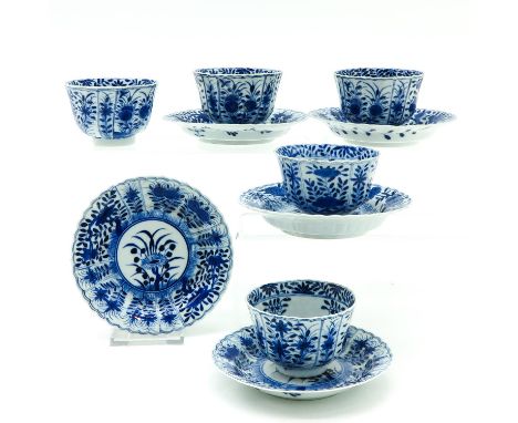 Including 5 cups and saucers, 13 cm. in diameter, including Kangxi mark, chip and hairline.