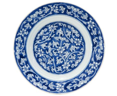 Floral decor, marked with double ring and artemisia leaf, 28 cm. in diameter, chips on edge.
