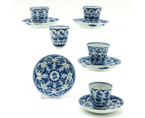 Including 5 cups and saucers, 13 cm. in diameter, blue and white floral decor, 18th Century, marked with double fish, chip an