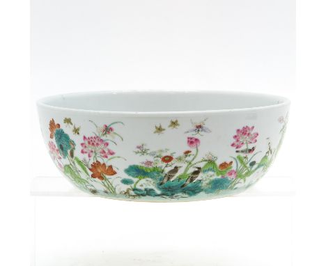 Depicting garden scene with flowers and birds, 23 cm. in diameter. 