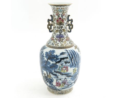 Decorated in blue enamels with Famille Rose and gilt accents, depicting Chinese figures in bamboo garden, 36 cm. tall, Qianlo