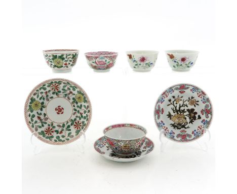 Including 5 cups and 3 saucers, 13 cm. in diameter, including Kangxi Mark and Period, chip and hairline.