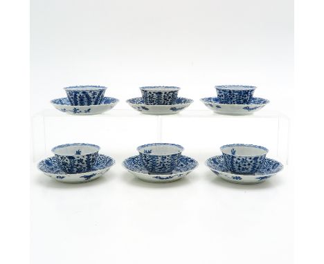 Floral decor, marked with double ring and hare, saucers are 14 cm. in diameter, one cup restored, fritting on edges.