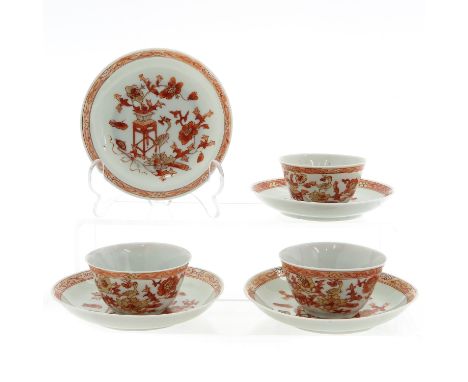 Including 3 cups and 4 saucers, 12 cm. in diameter, 18th Century, Milk and Blood decor, chip and hairline.