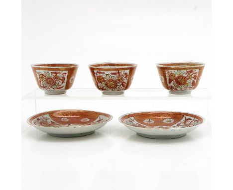 Including 3 cups and 2 saucers, iron red and gilt floral decor, saucers are 11 cm. in diameter.