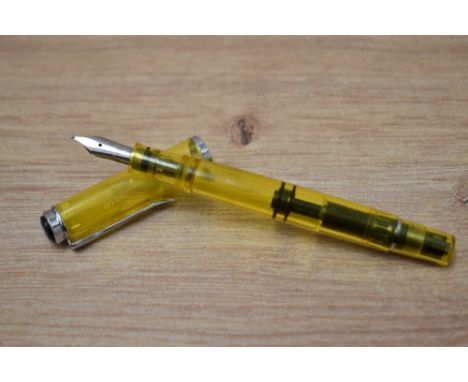 A Pelican M205 Duo Yellow Highlighter piston fill fountain pen having Pelikan B nib