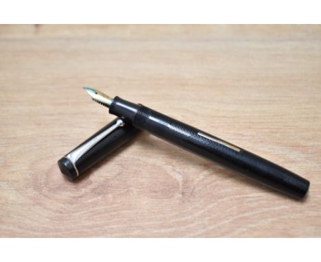 A boxed Stephens 76 lever fill fountain pen in  black with single narrow band to cap having Warranted Quality 14CT first qual