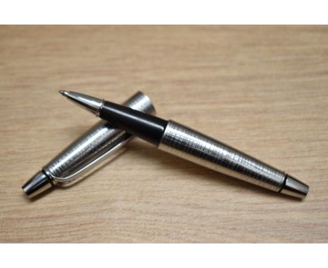 A Cross Stubby chrome rollerball pen.