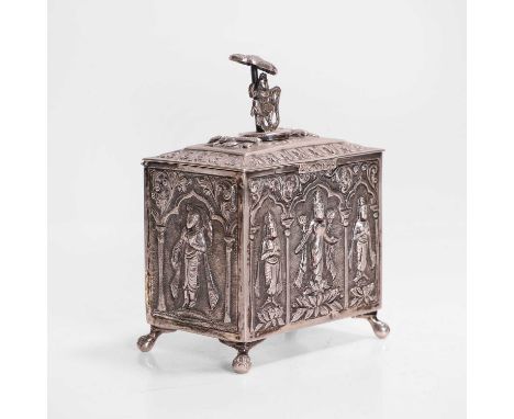 A white-metal tea caddy, late 19th century, Anglo-Indian, of square form with embossed and chased panels, the cover with a bo