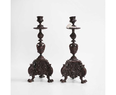 A pair of cast bronze candlesticks, 19th century, modelled after Renaissance pricket stands, each with a scalloped drip pan o