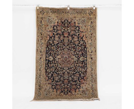 A blue-ground Nain rug, 20th century, Persian, the central field with a navy ground, within multiple foliage borders,203 x 11
