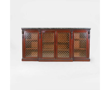 A mahogany and ebonised breakfront bookcase cabinet in the manner of Gillows, mid-19th century, the green marble top over a c