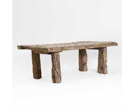 An olivewood table, of recent manufacture from aged timbers, the distressed three-plank top on square-form supports,138cm wid