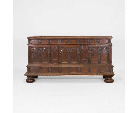 A walnut coffer, 18th/19th century, Spanish, the lift-up top opening to reveal a compartment, over an arcaded front set with 