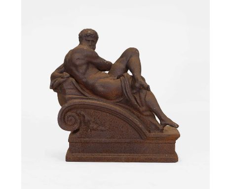 After Michelangelo, 20th century, a cast iron figure of a reclining male nude, emblematic of 'Day', raised on a scrolling ste