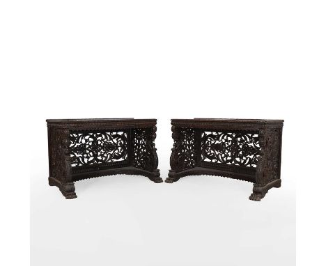 A pair of rosewood console tables, mid-19th century, Anglo-Indian, each with a rectangular top with a low raised gallery and 