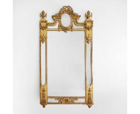 A Louis XVI-style gilt wall mirror, 19th century, French, the shaped crest surmounted by a ribbon-tied garland and bow, over 