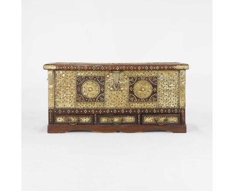 A hardwood and brass-mounted storage chest, c.1880-1900, Zanzibar, the hinged top enclosing a side box, the front with a hing