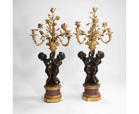 A pair of large gilt-bronze, bronze, and porphyry candelabra after Jean-Louis Prieur, 19th century, French, each modelled as 
