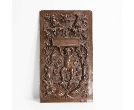 A Renaissance-style bronzed-metal plaque, 20th century, decorated in repoussé, with a cherub holding a rectangular casket alo