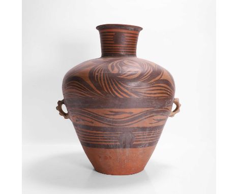 A Neolithic-style terracotta storage jar or urn, the tapering body set with lug handles to either side, and decorated in blac