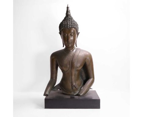 A bronze figure of the Buddha, probably 17th century, Thai, Sukhothai-style, modelled with a downcast gaze, his tightly curle
