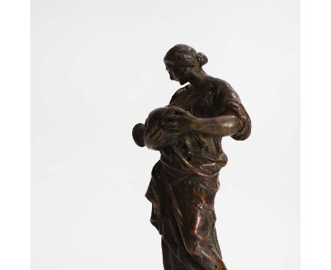 A bronze female figure, 17th/18th century, Italian, Florentine, holding an urn and wearing flowing robes, raised on a marble 