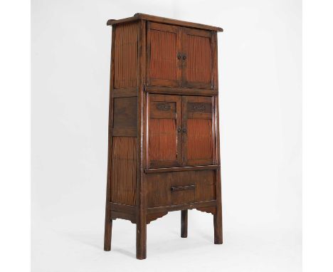 A pine and bamboo cabinet, Qing dynasty (1644-1911), Chinese, of tapering form with two cupboards, both with bamboo panelling