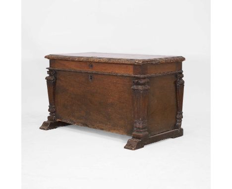 A walnut cassone, predominantly late 16th/early 17th century, North Italian, the hinged lid with a foliate-carved edge, above