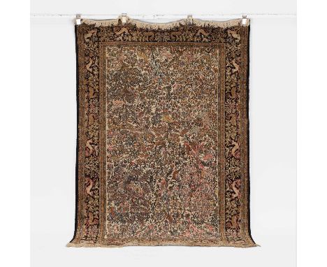 A Qum carpet, mid-20th century, Persian, decorated with animals and foliage, within similarly decorated borders, 205 x 136cm
