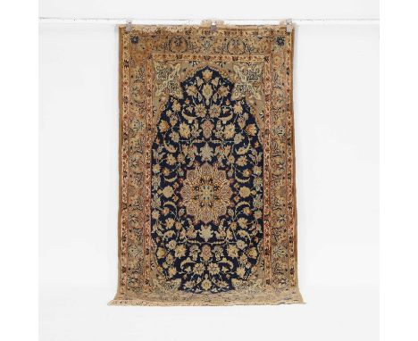 A Nain rug, 20th century, Persian, the central blue field with an ivory medallion and repeating scrolls,200 x 100cm