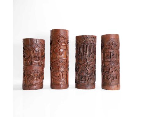 Four bamboo brush pots, 20th century, Chinese, each of cylindrical form, carved with literati at various pursuits, amongst ba