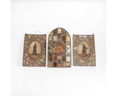 A pair of figural stained-glass panels 19th century, each central oval panel depicting a male or female figure in medieval dr