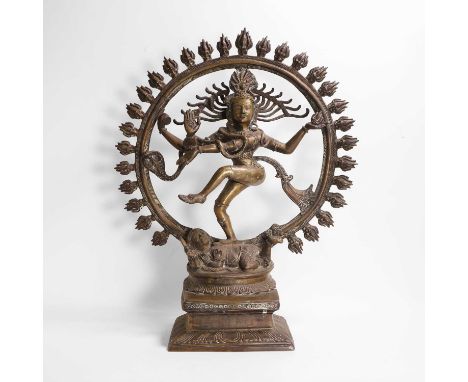 A large bronze model of Shiva Nataraja, 20th century, Indian, the dancing four-armed deity holding attributes of a drum and f