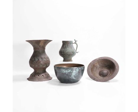 A group of metalwares, 12th-15th century, Persian, comprising a circular, footed, white-metal bowl, inscribed with calligraph