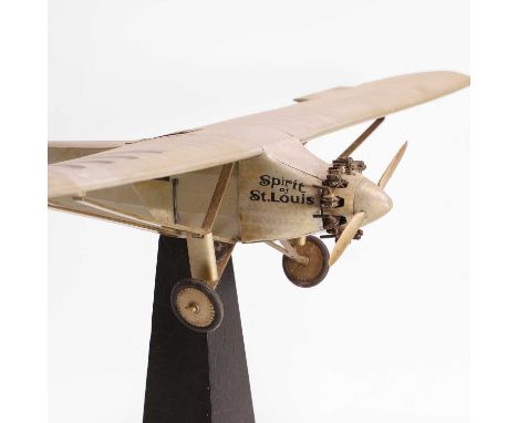 A scratch-built model of the aeroplane 'Spirit of St. Louis', 20th century, raised on a tapering stand,plane 49cm long39cm wi