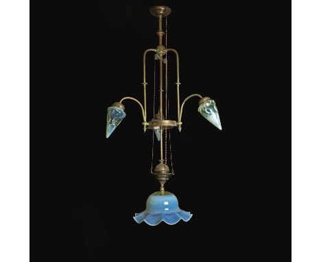 A large Arts and Crafts brass four-light electrolier in the Manner of WAS Benson, late 19th/early 20th century, the rise-and-
