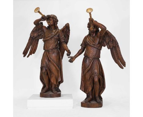 Attributed to Hendrik Frans Verbruggen (Flemish, 1654-1724), a pair of large, baroque, carved oak, herald angels, each modell