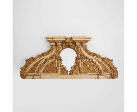 A baroque-style painted and gilt altarpiece or architectural cresting, 19th century and later, Italian, centred with an arche