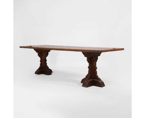 A Gothic-style oak refectory table, late 19th/early 20th century but possibly incorporating some earlier elements, the plank 