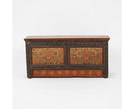 A pine and painted altar cupboard, 19th century, Tibetan, the twin-panelled front with a single door, painted throughout with