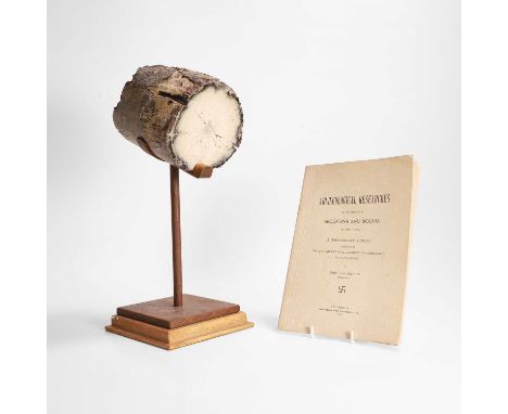 A petrified ivory tusk section, on an iron stand13cm diameter13.5cm high37cm high overallProvenance: Provenance: Count Eric v