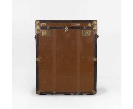 A linoleum and metal-mounted upright trunk, the hinged top with double latches, opening to reveal two leather straps, the int