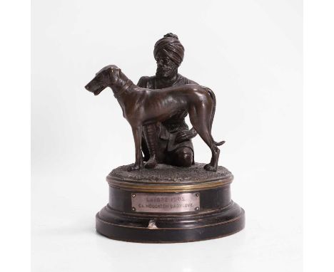 A bronze figural group, late 19th/early 20th century, Indian, mounted with a bronze of a dog and a kneeling Sikh keeper, insc
