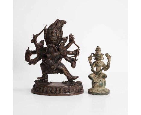 A bronze figure of Vajrabhairava, 13cm wide7cm deep19cm high, anda smaller bronze figure of a deity (2)Condition Reportvery l