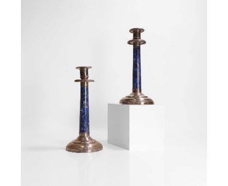 A pair of silver and lapis lazuli-mounted candlesticks, 20th century, each drip pan with a gadrooned rim, over a tapering col